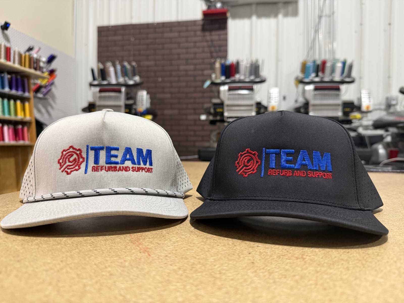 Embroidered five-panel caps at the machine