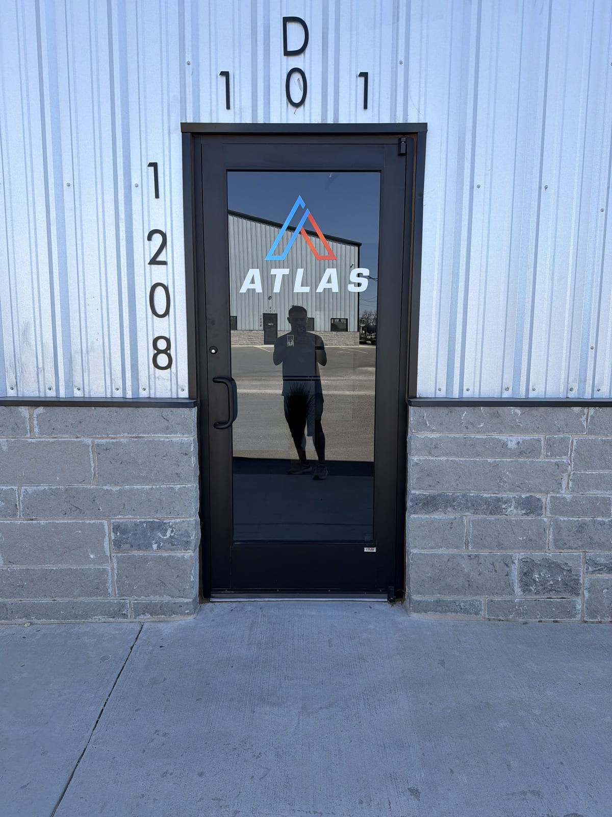 Vinyl logo install on a glass entry door