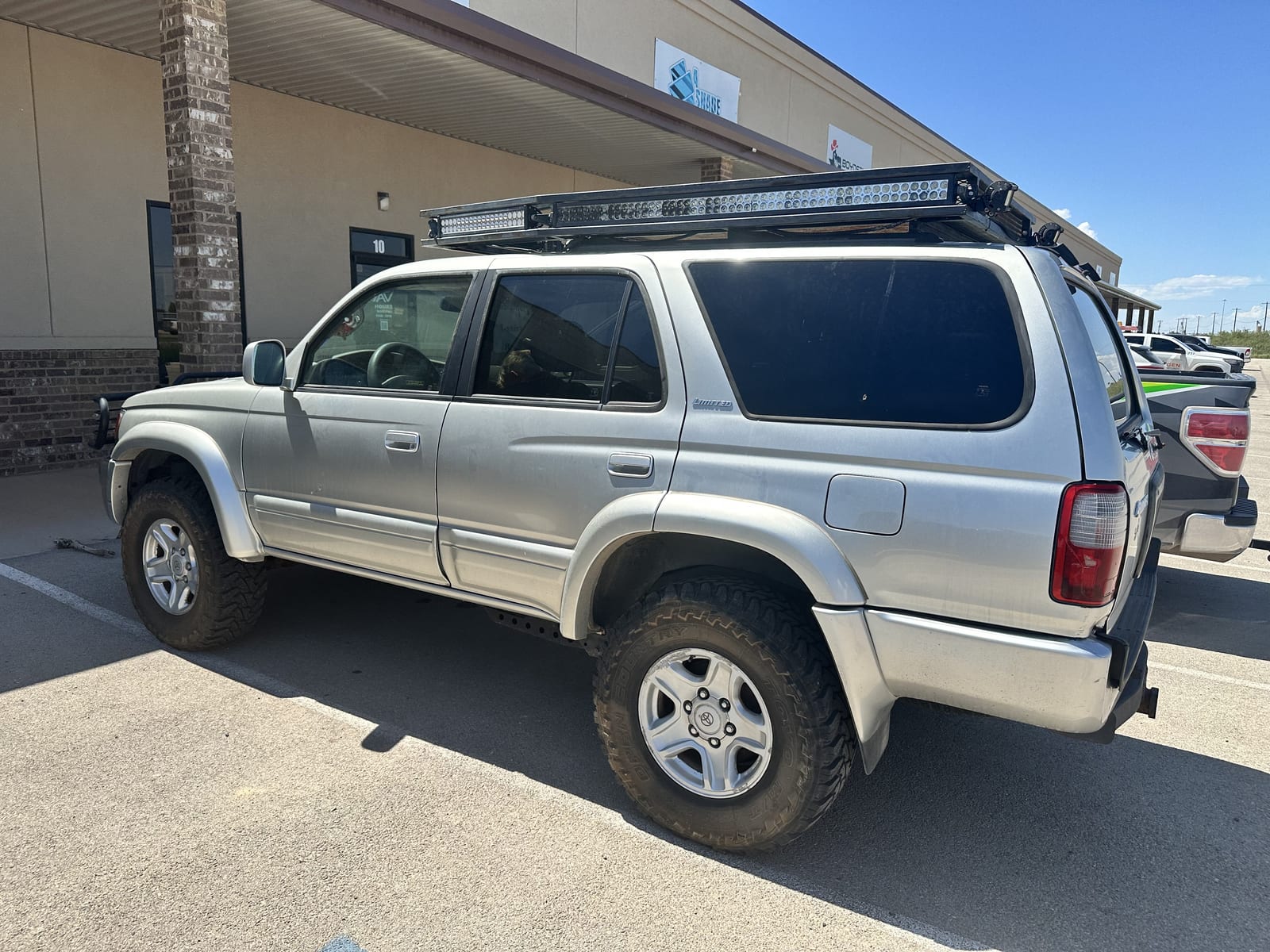 Silver 4Runner with weathered factory paint before wrapping